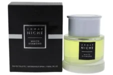 White Diamond de Armaf: Botella moderna de vidrio amarillo pálido con tapa blanca, diseño sobrio y lujoso.